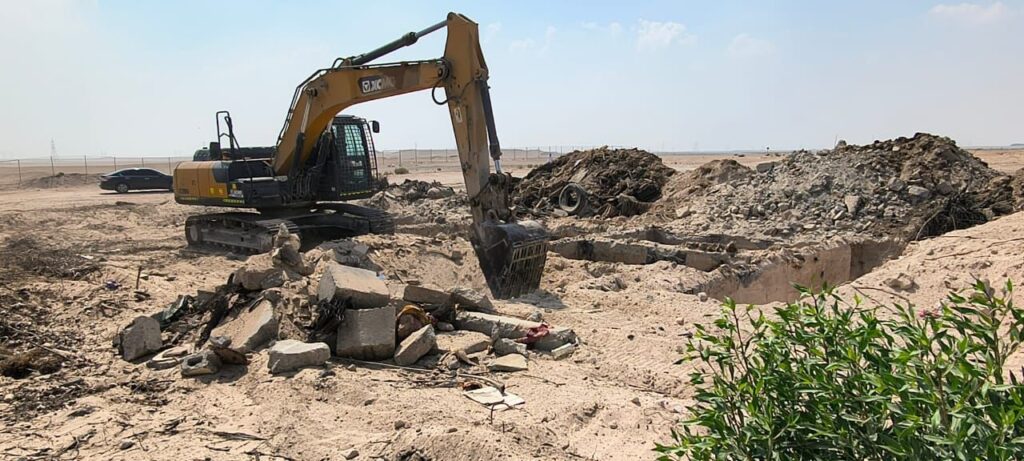 Demolition debris removal with excavator